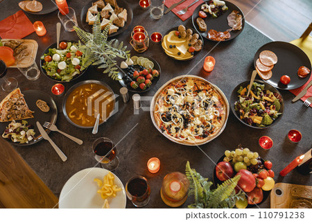 Top view of brunch table with different delicious food and beverages ready for friends home party Top view of brunch table with different delicious food and beverages ready for friends home party 110791238