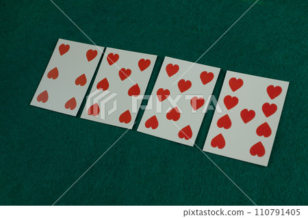 Old west era playing card on gambling table. 6,7,8,9 of hearts. 110791405