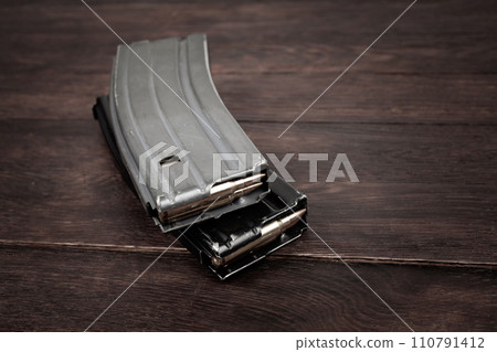 Ammunition with magazine on wooden 110791412