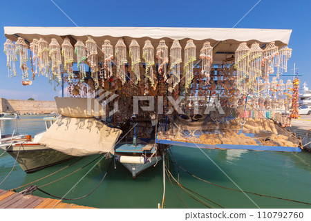 Fishing boat with souvenirs in Mandrak harbor on Rhodes island. Fishing boat with souvenirs in Mandrak harbor on Rhodes island. 110792760