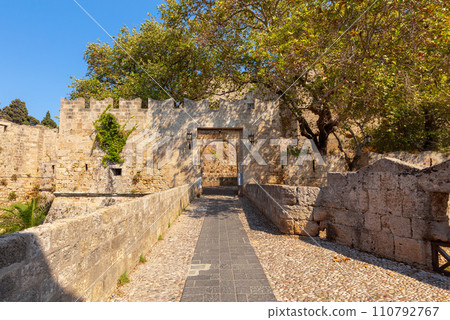 Old stone city wall in the city of Rhodes. Old stone city wall in the city of Rhodes. 110792767