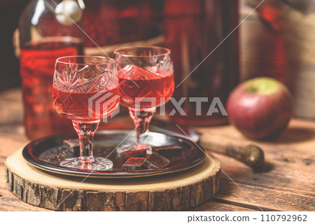 Homemade berry alcoholic beverage and chocolate Homemade berry alcoholic beverage and chocolate 110792962