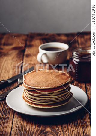 Stack of pancakes on white plate 110792986