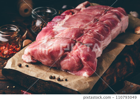 Raw pork loin joint with different spices 110793049
