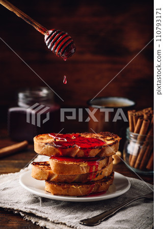 Stack of french toasts with berry syrup 110793171