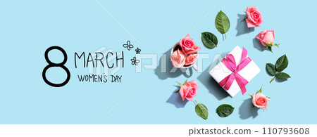 Happy womens day message with a gift box and roses Happy womens day message with a gift box and roses 110793608