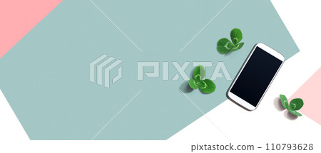 White smartphone with shamrock leaves White smartphone with shamrock leaves 110793628