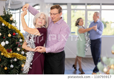 Adult man and elderly woman dance waltz 110793917