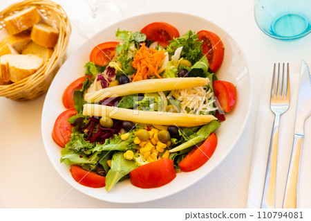 Appetizing Spanish salad with cheese, asparagus and fresh vegetables Appetizing Spanish salad with cheese, asparagus and fresh vegetables 110794081