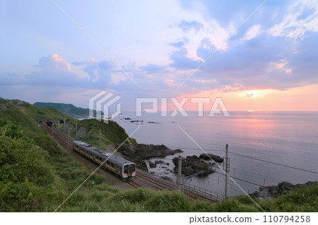 Shinetsu Main Line and the Sea of Japan sunset 110794258