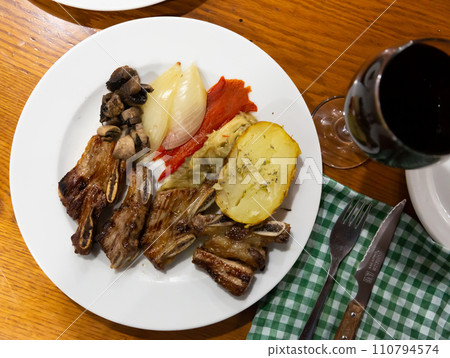 roasted veal ribs with potato roasted veal ribs with potato 110794574