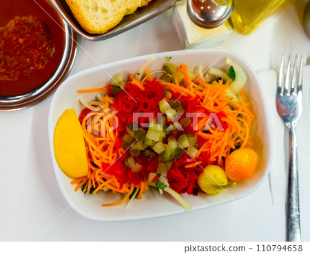 Seasonal vegetable salad with carrot and cucumber 110794658