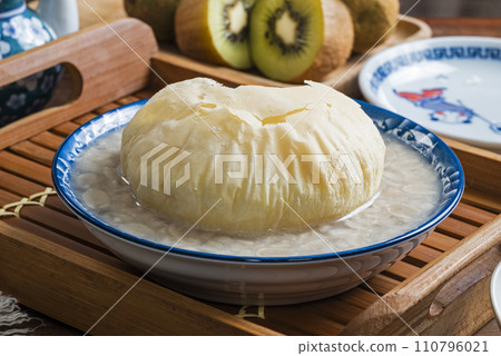 Sweet peanut soup with brown sugar bun cake in a bowl  110796021