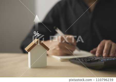 The growth of investment in real estate. Future planning Including financial planning and long-term investments. Small wooden house model The growth of investment in real estate. Future planning Including financial planning and long-term investments. Small wooden house model 110796239