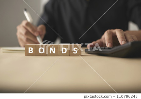 Investment funds and bonds. Plan to invest in bonds and analyze economic data. Little wooden blocks and men are planning 110796243