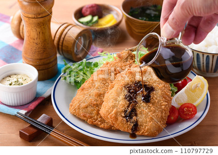 put sauce on fried horse mackerel 110797729