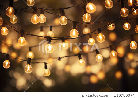 a string of lights hanging on the tree bokeh style background with generative ai 110799074