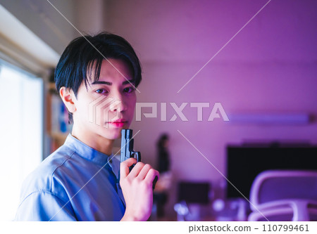 portrait of a man with a gun 110799461