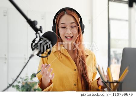 Live Podcast Session with Smiling Female Host. Live Podcast Session with Smiling Female Host. 110799679