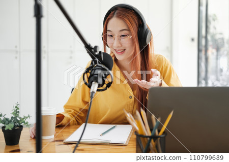 Live Podcast Session with Smiling Female Host. 110799689