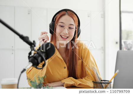 Live Podcast Session with Smiling Female Host. Live Podcast Session with Smiling Female Host. 110799709
