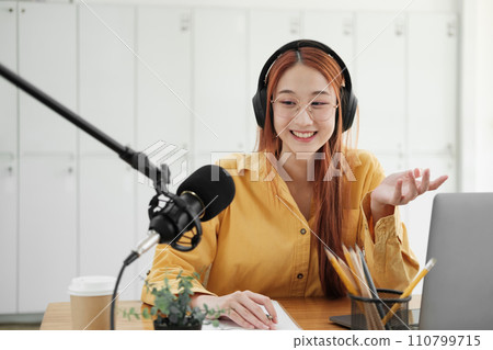 Live Podcast Session with Smiling Female Host. Live Podcast Session with Smiling Female Host. 110799715