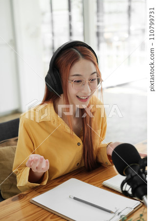 Live Podcast Session with Smiling Female Host. Live Podcast Session with Smiling Female Host. 110799731
