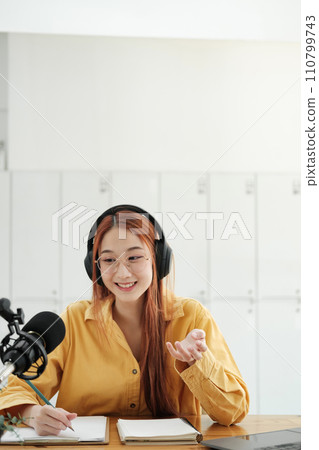 Live Podcast Session with Smiling Female Host. 110799743