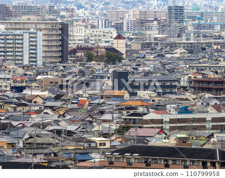 Scenery of a densely populated residential area seen from the mountain Scenery of a densely populated residential area seen from the mountain 110799958