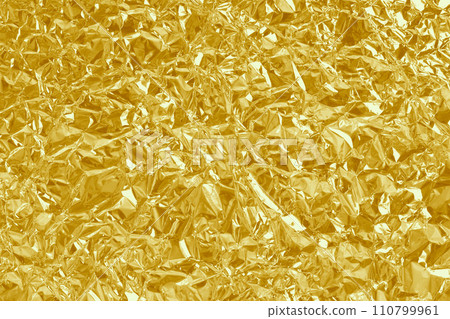 Gold foil leaf shiny texture, abstract yellow wrapping paper for background and design art work. 110799961