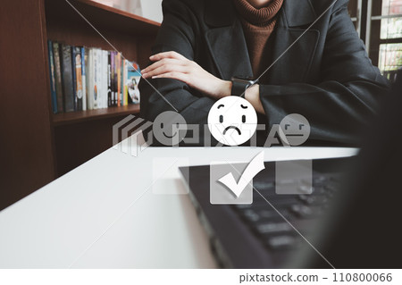 Customer satisfaction concept, evaluate dissatisfied low service by laptop, discontent and not satisfied, choose no smile 110800066