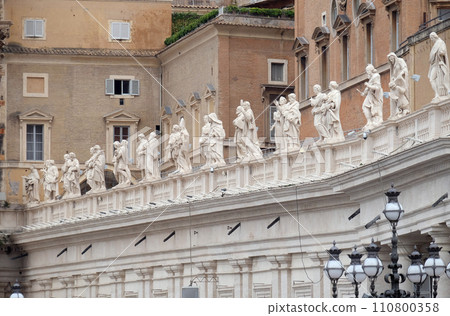 Gallery of saints, fragment of colonnade of St. Peters Basilica in Vatican, Rome, Italy 110800358