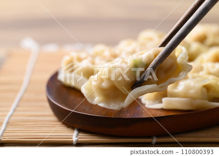 Steamed wonton dumpling stuffed with minced pork and chicken ready to eating Steamed wonton dumpling stuffed with minced pork and chicken ready to eating 110800393