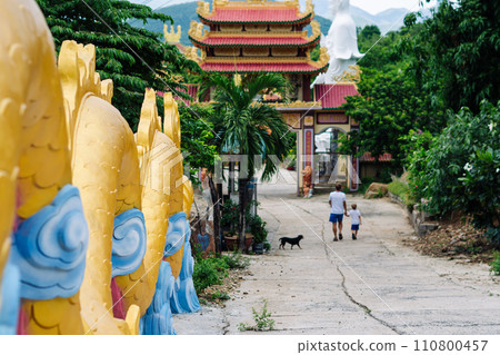 Father and son tourists walking in Vietnam Buddhist Temple, happy childhood, exploring world 110800457