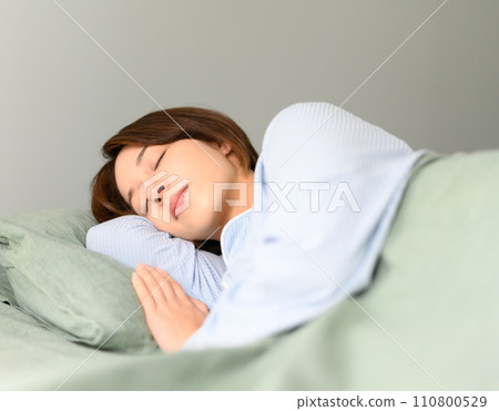 beautiful woman in pajamas beautiful woman in pajamas 110800529