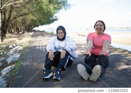 happy asian women warming up together happy asian women warming up together 110801503