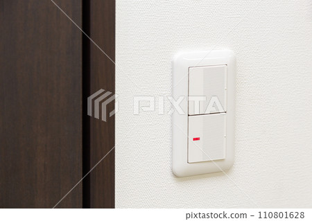 light switch installed on the wall 110801628
