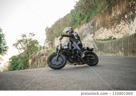 asian rider riding motorcycle highway road 110801860