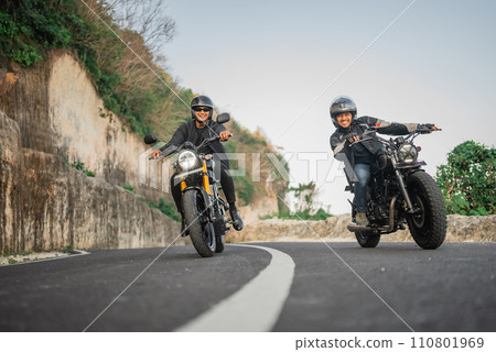 happy asian bikers riding motorcycle together 110801969