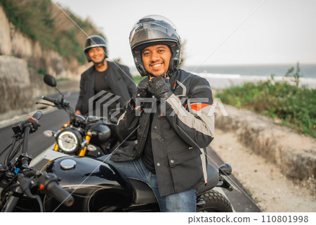 indonesian man tighten helmet safety riding 110801998