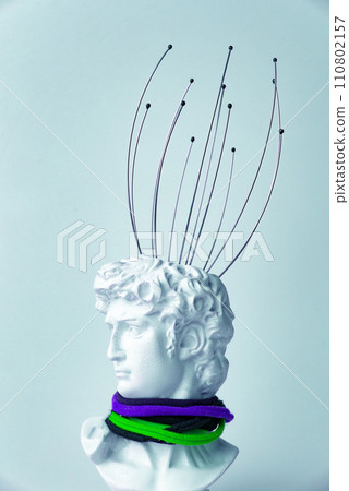 Antique male David statue's head with manual Massager for head isolated on a white background. 3d trendy cretive collage in magazine style. 3d contemporary art. Modern design 110802157