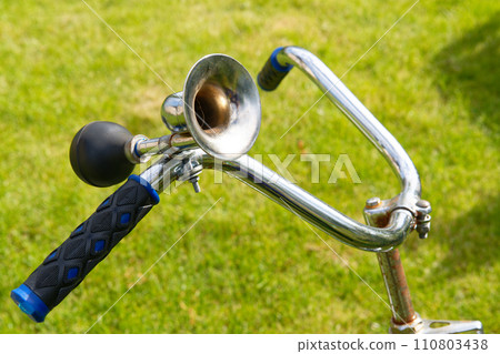 Vintage bicycle horn on handlebar 110803438