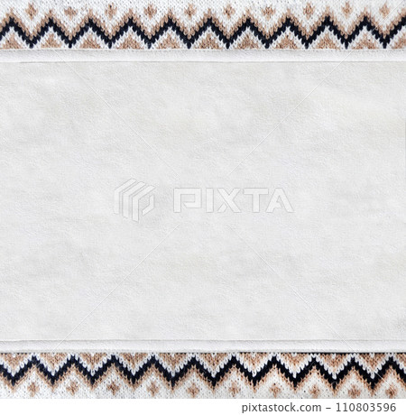 Horizontal or vertical backdrop with suede texture and border of wool material with knitted ornament. Background for scrapbooking with suede leather and sweater knitted texture. Copy space for text 110803596