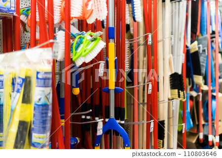 Large assortment of brushes for cleaning premises in the store. Trade in floor cleaning equipment Large assortment of brushes for cleaning premises in the store. Trade in floor cleaning equipment 110803646