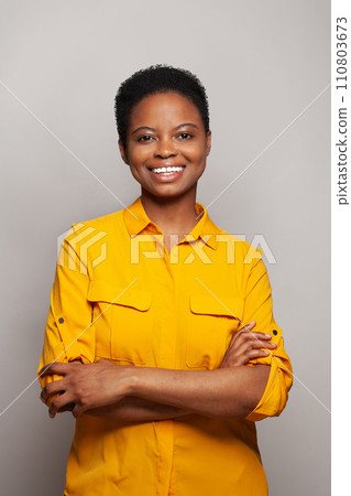 Friendly happy woman smiling and having fun against white studio wall background Friendly happy woman smiling and having fun against white studio wall background 110803673