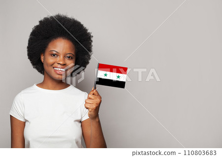 Syrian woman holding flag of Syria Education, business, citizenship and patriotism concept Syrian woman holding flag of Syria Education, business, citizenship and patriotism concept 110803683