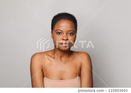 Young healthy african american woman with clear fresh dark skin posing Young healthy african american woman with clear fresh dark skin posing 110803691