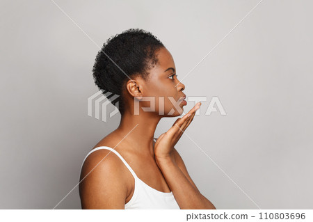 Perfect healthy african american woman with clear fresh dark skin posing  110803696