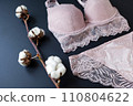 woman pink lace bra, panties lingerie with cotton buds on black. Shopping-fashion wardrobe concept 110804622