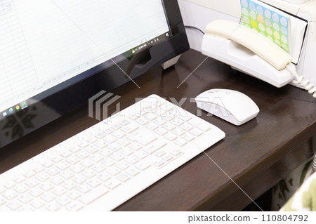 Dusty computer keyboard and mouse 110804792